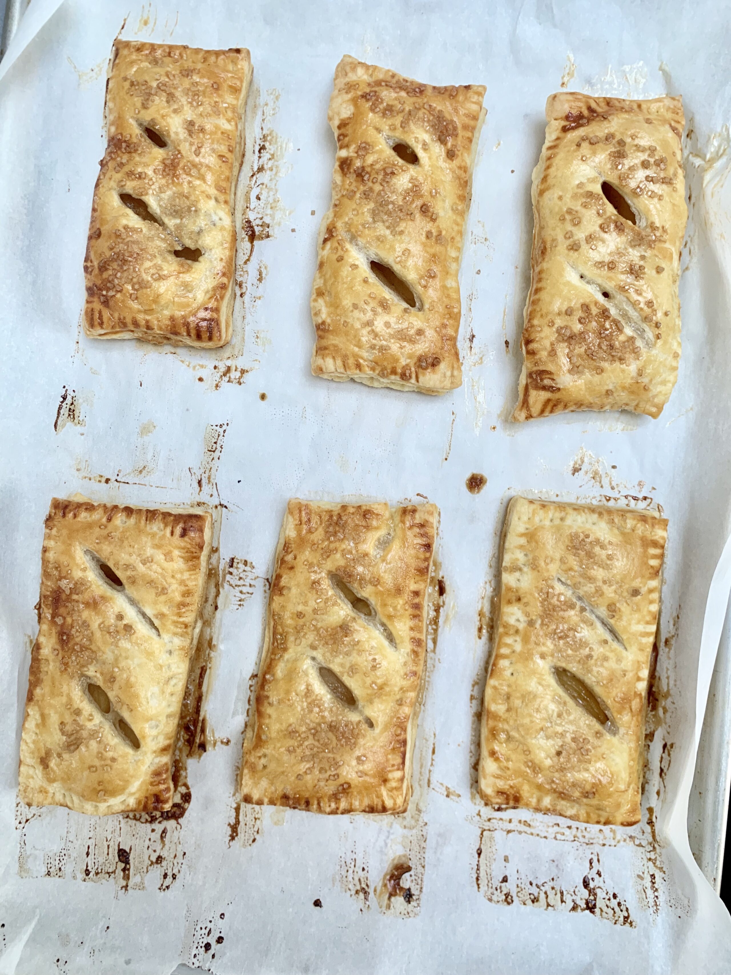 apple hand pies on baking sheet