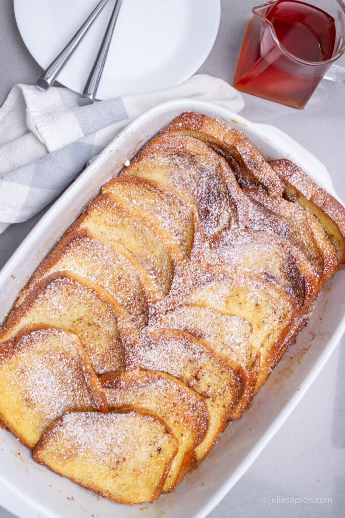 french toast bake in white casserole dish