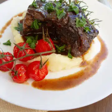 Stovetop braised short ribs simmered until tender in a rich savory sauce, an easy homemade comfort dinner recipe