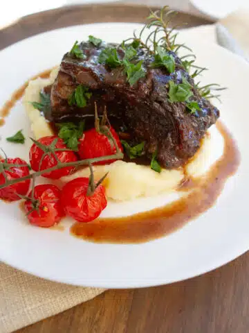 Stovetop braised short ribs simmered until tender in a rich savory sauce, an easy homemade comfort dinner recipe