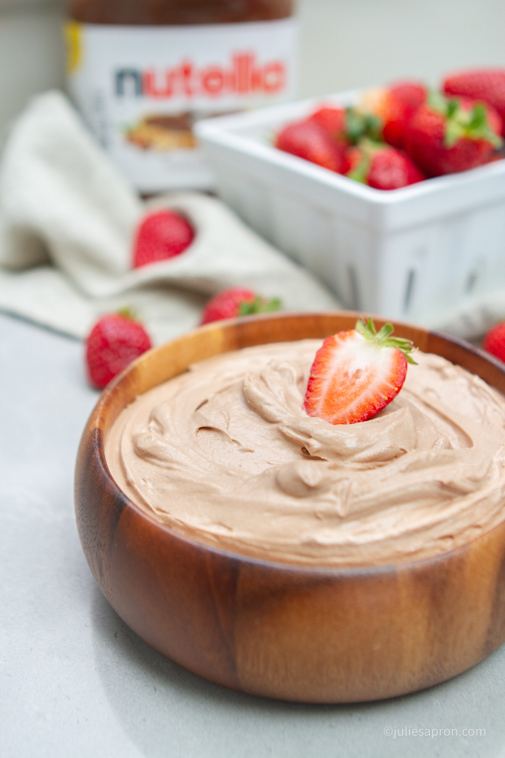 nutella dip with nutella jar in background 