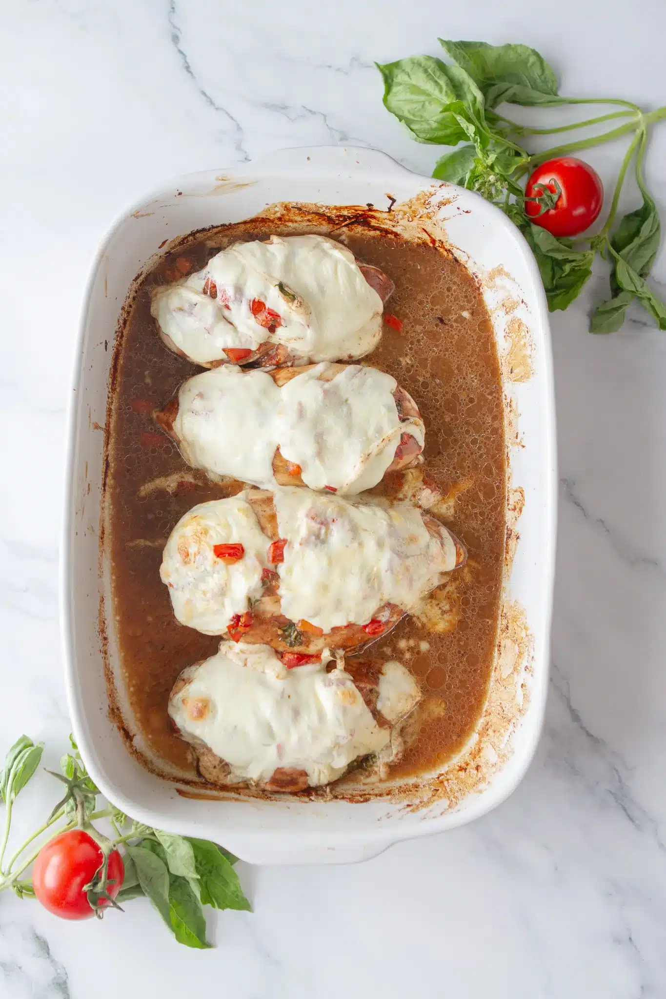 melted mozzarella cheese on top of bruschetta chicken