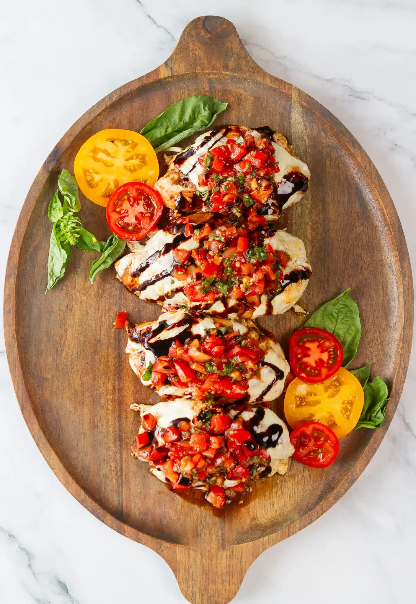 chicken on a large platter with bruschetta