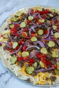 pizza with cheeseburger toppings raw
