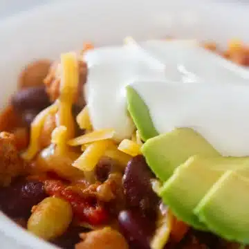 turkey chili recipe panera topped with sour cream and avocado