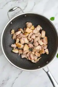 browned chicken in large skillet