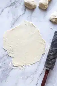 rolled out tortilla dough