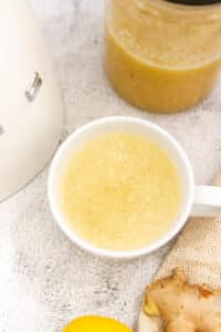 hot lemon ginger honey tea in a tea cup